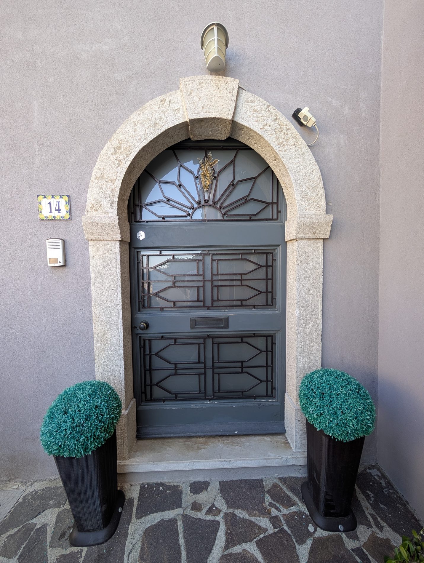 Arched stone front doorway of the house
